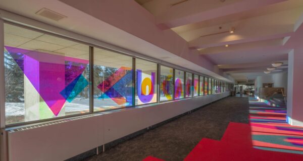 Image credit: Joi T. Arcand, ᐁᐸᐢᐹᐱᐟ ᐚᓰᓇᒫᓂᕁ ᐚᐸᐦᑕᑦ ᐁᓈᓈᐦᑌᔨᐠ (Looking out her window she watches a moving mirage of dazzling light), dichroic film, 2021, MacKenzie Art Gallery Permanent Collection. Photo by: Don Hall.